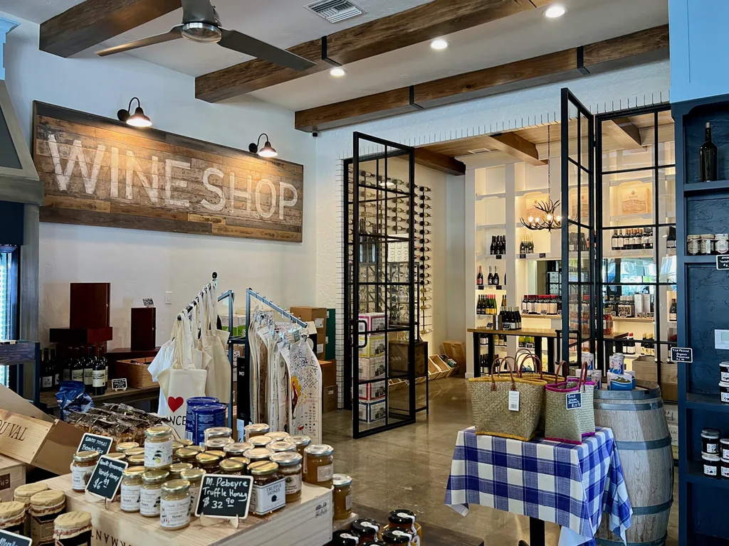 Wine shop shelving stocked with bottles at the St. Germain Gourmet Market